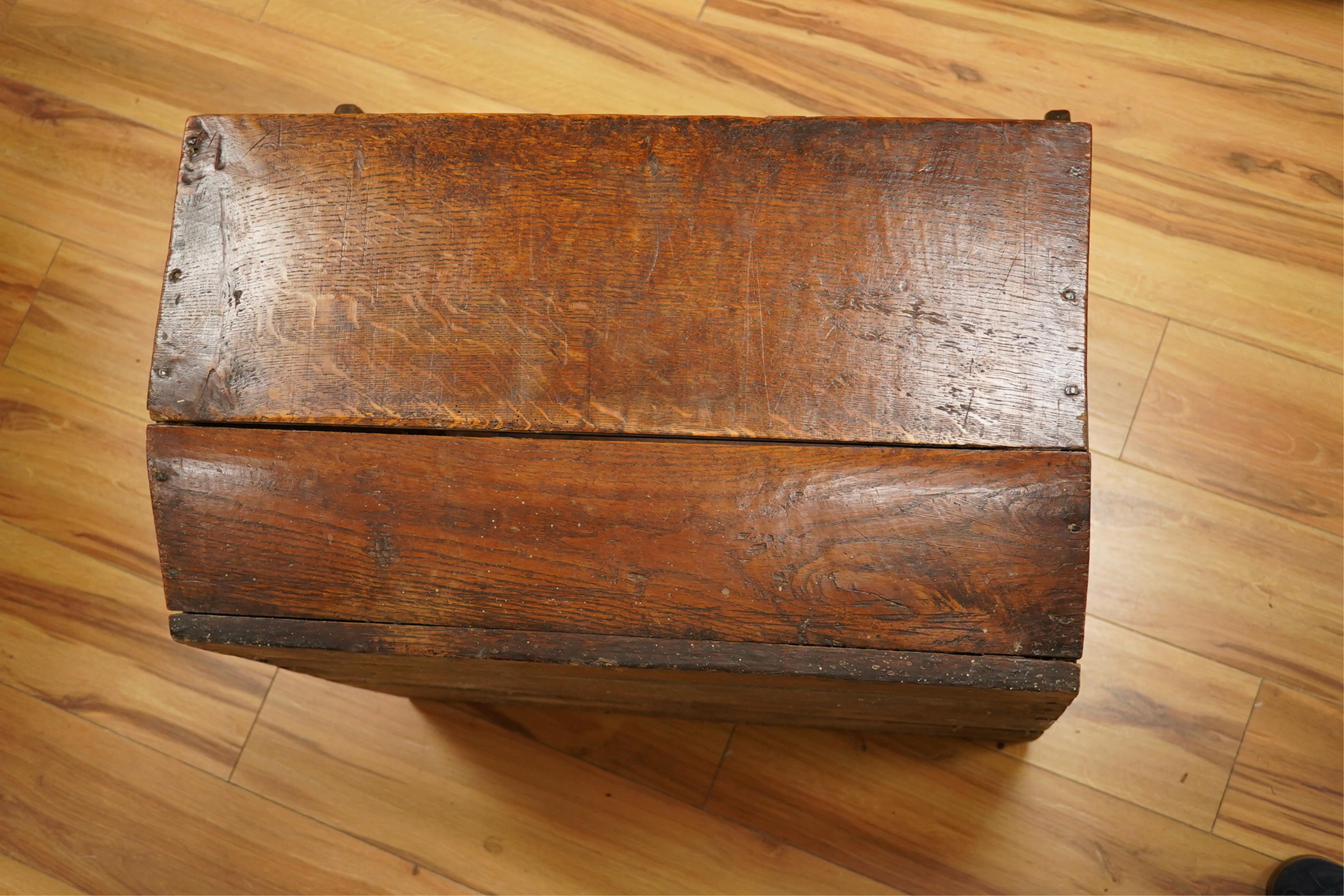 An early 20th century oak dog basket, 65cm wide. Condition - fair